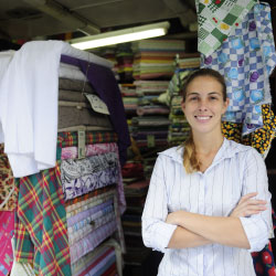 Woman standing outside fabric store