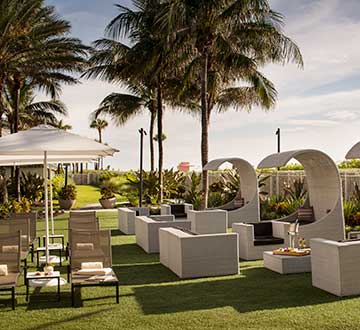 Cabana and chairs on a resort lawn